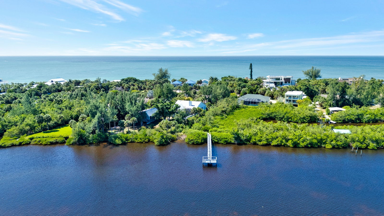 Aerial view of the Manasota Key shoreline with dock and Gulf beyond