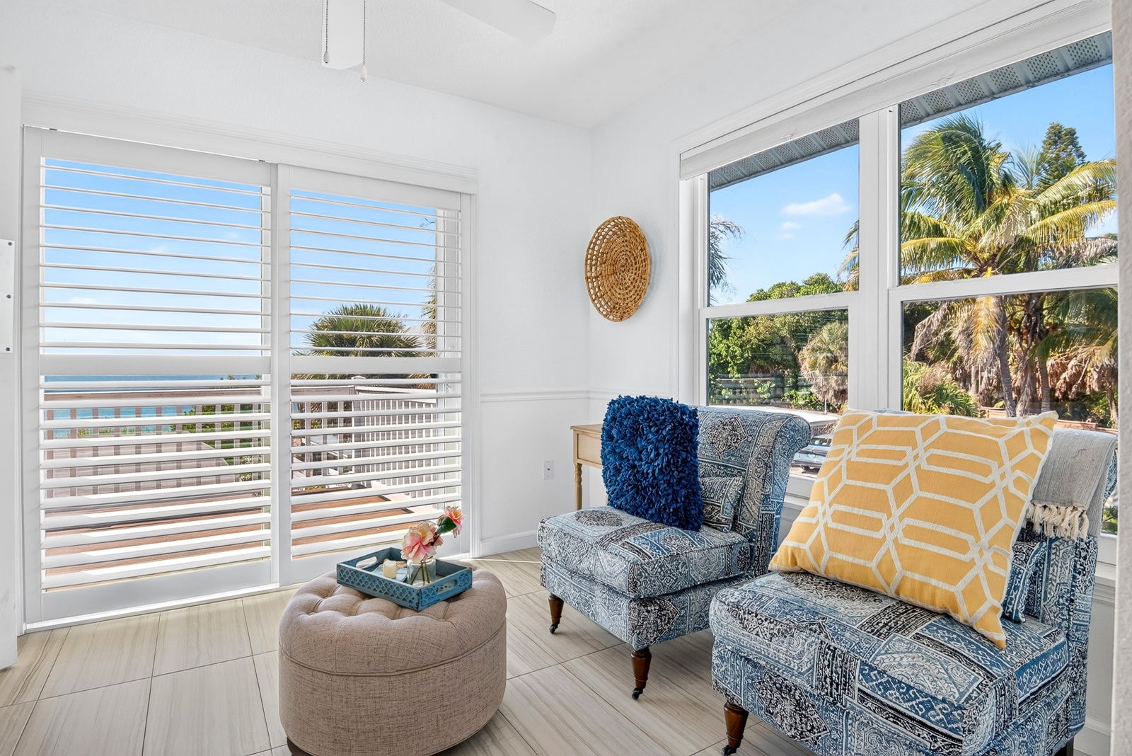 Sitting room with shuttered windows opening to Gulf views