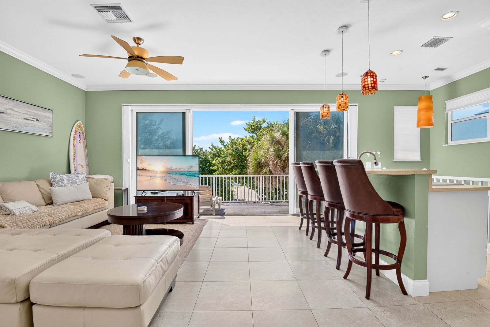 Great room with sliding doors opening to the beach deck